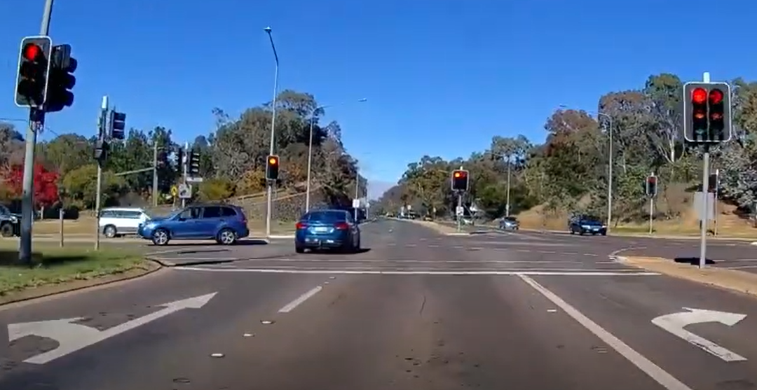 dashcam footage of car running a red light