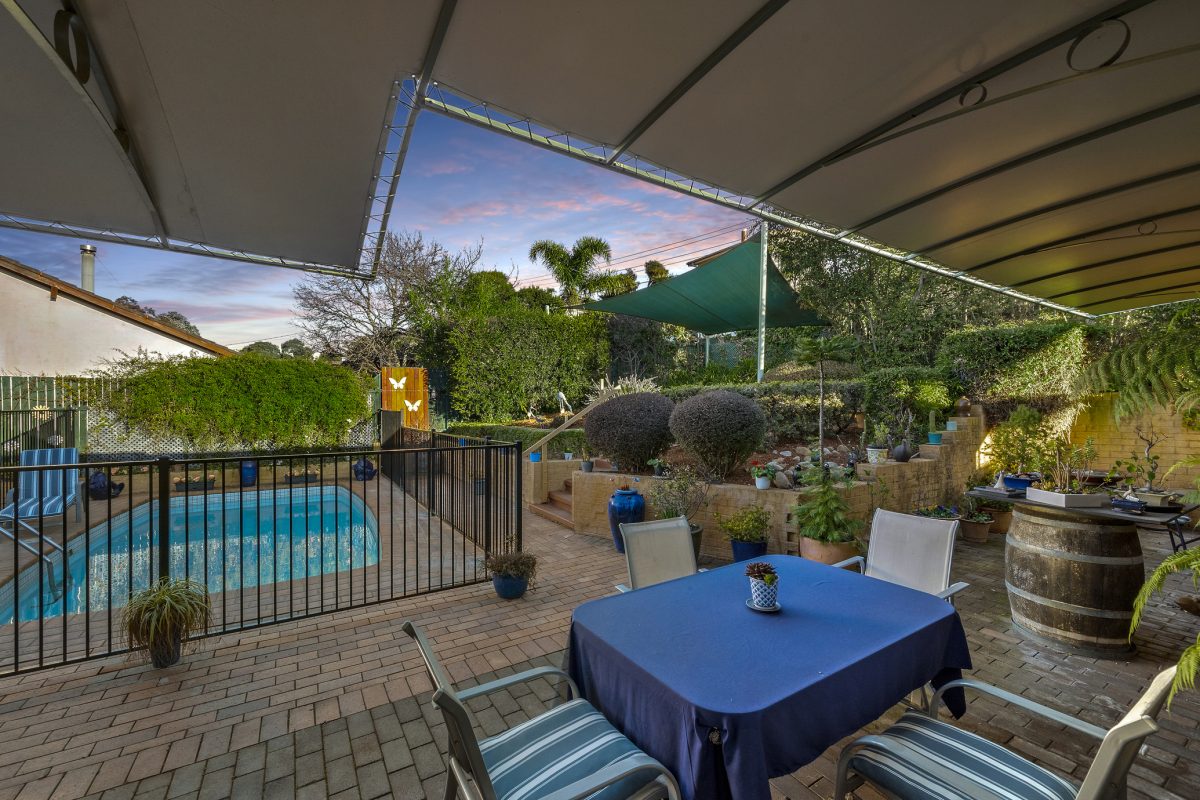 Back yard with pool and seating area