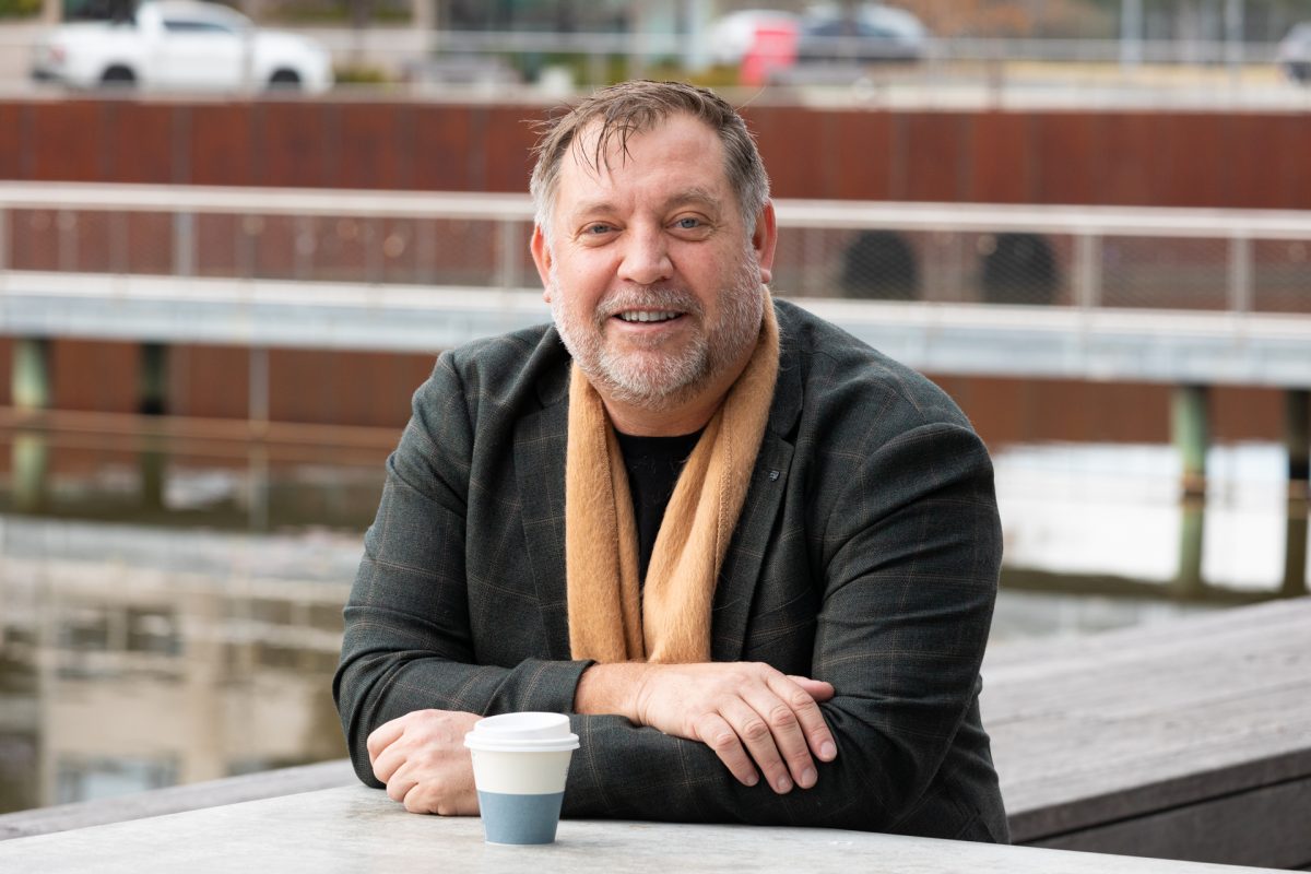 Man seated with coffee cup