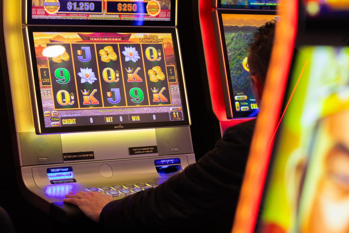 Man playing on a poker machine