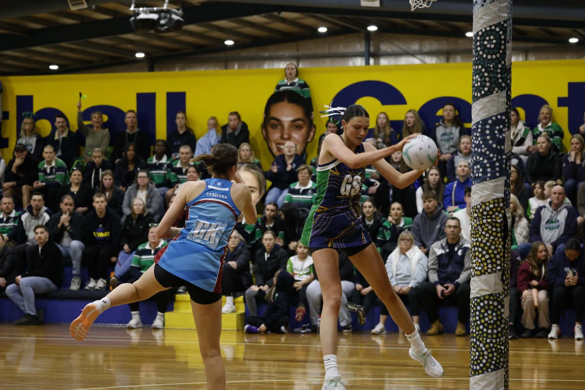 two netballers in action during a match