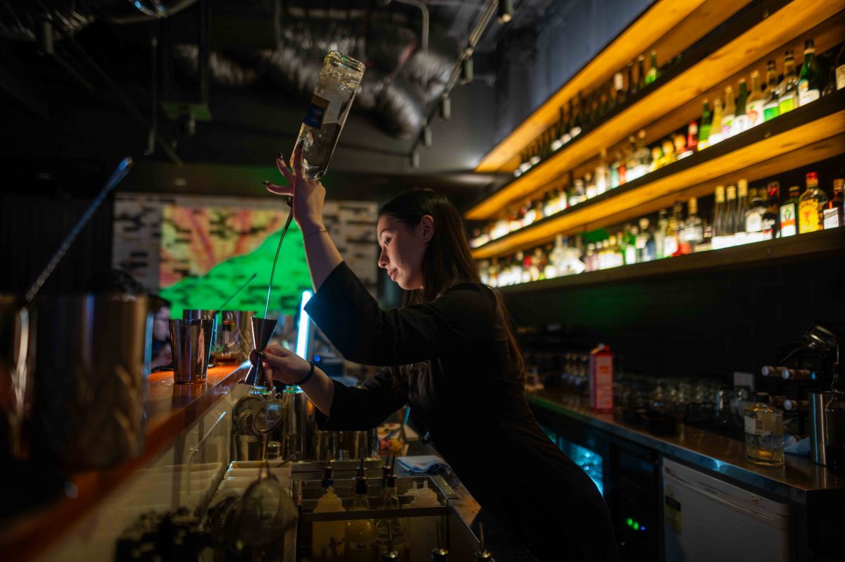 woman making cocktails