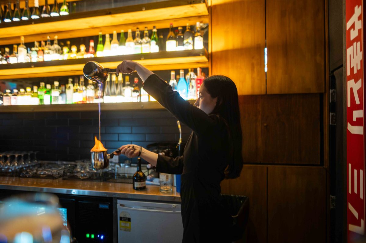 woman making a cocktail