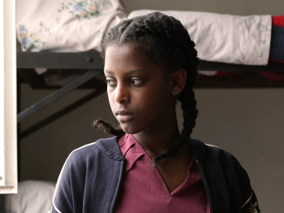 Still from Difret showing the profile of a young woman