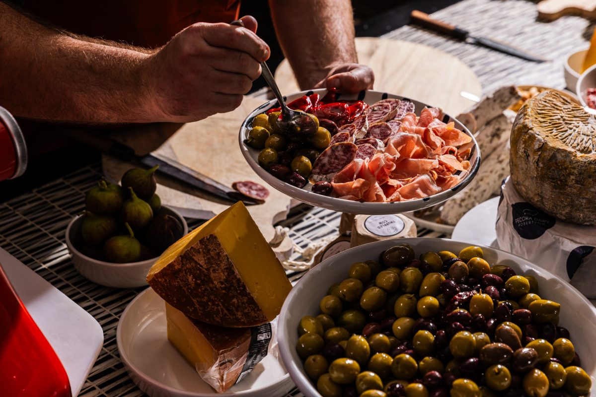 Person prepares a platter of food