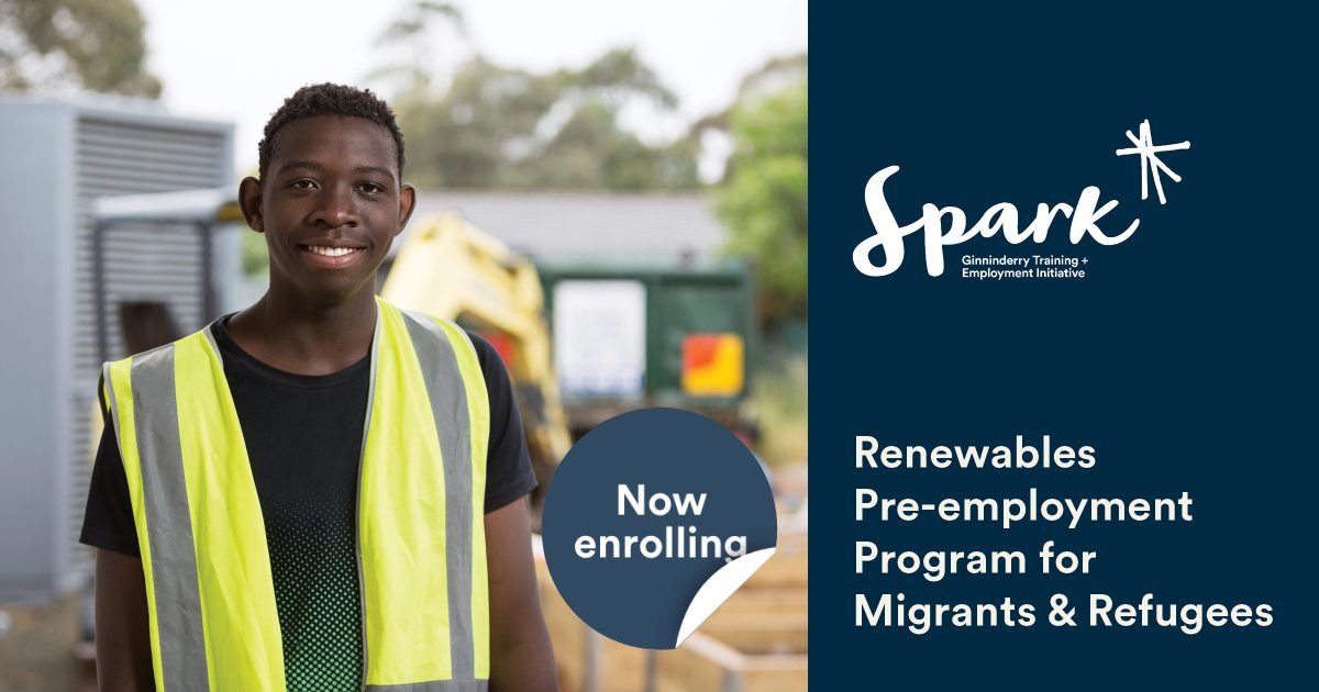 Man looking at the camera, with high vis vest on. Text to the right that says: Renewables Pre-employment Program for Migrants and Refugees