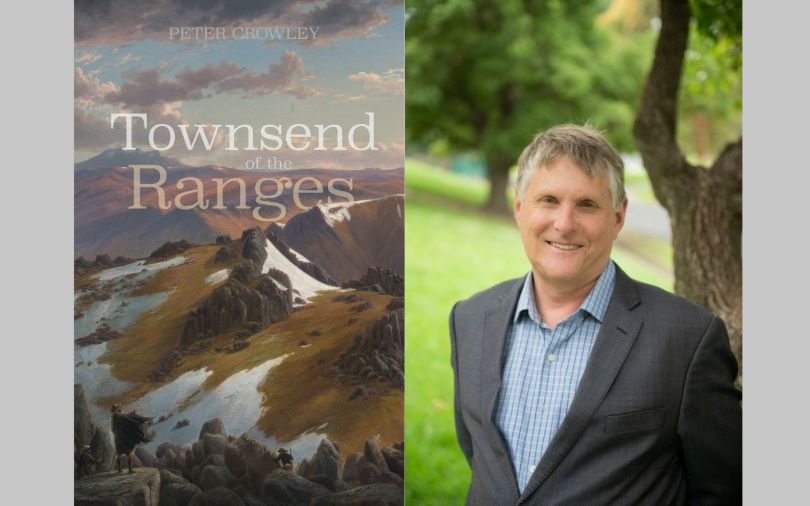 A photograph of a man with his book cover for 'Townsend of the Ranges.'