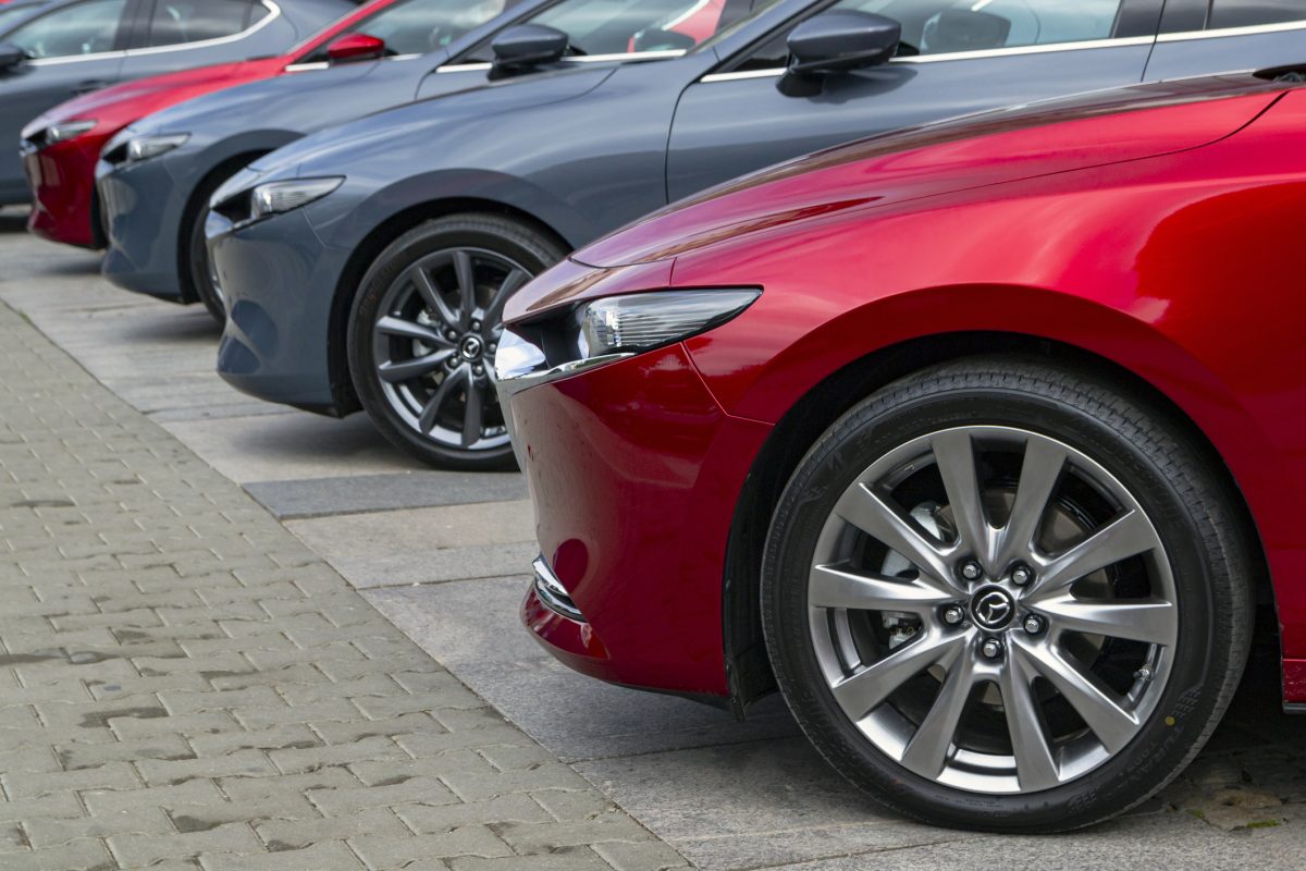 Red Mazda cars on the parking in a row