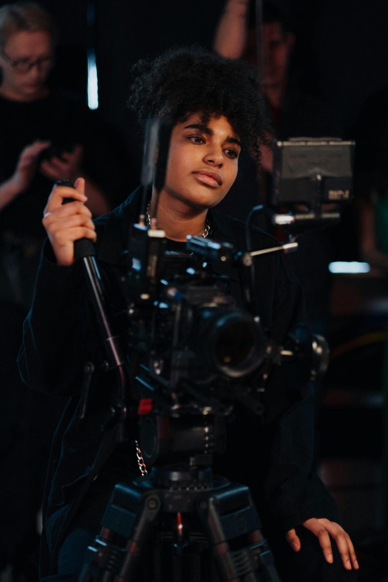 A woman operating a camera