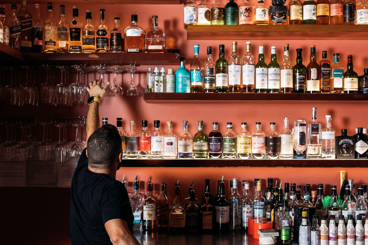 a man behind a bar counter