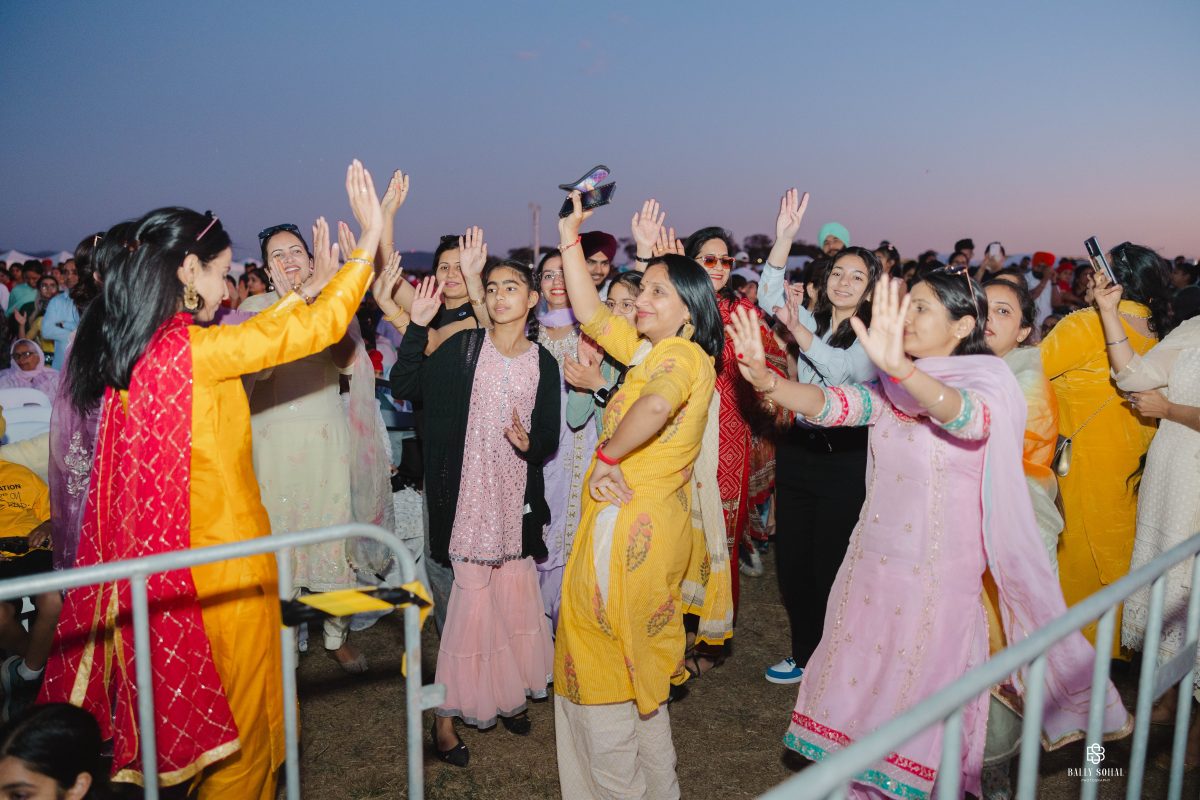 People standing around dancing