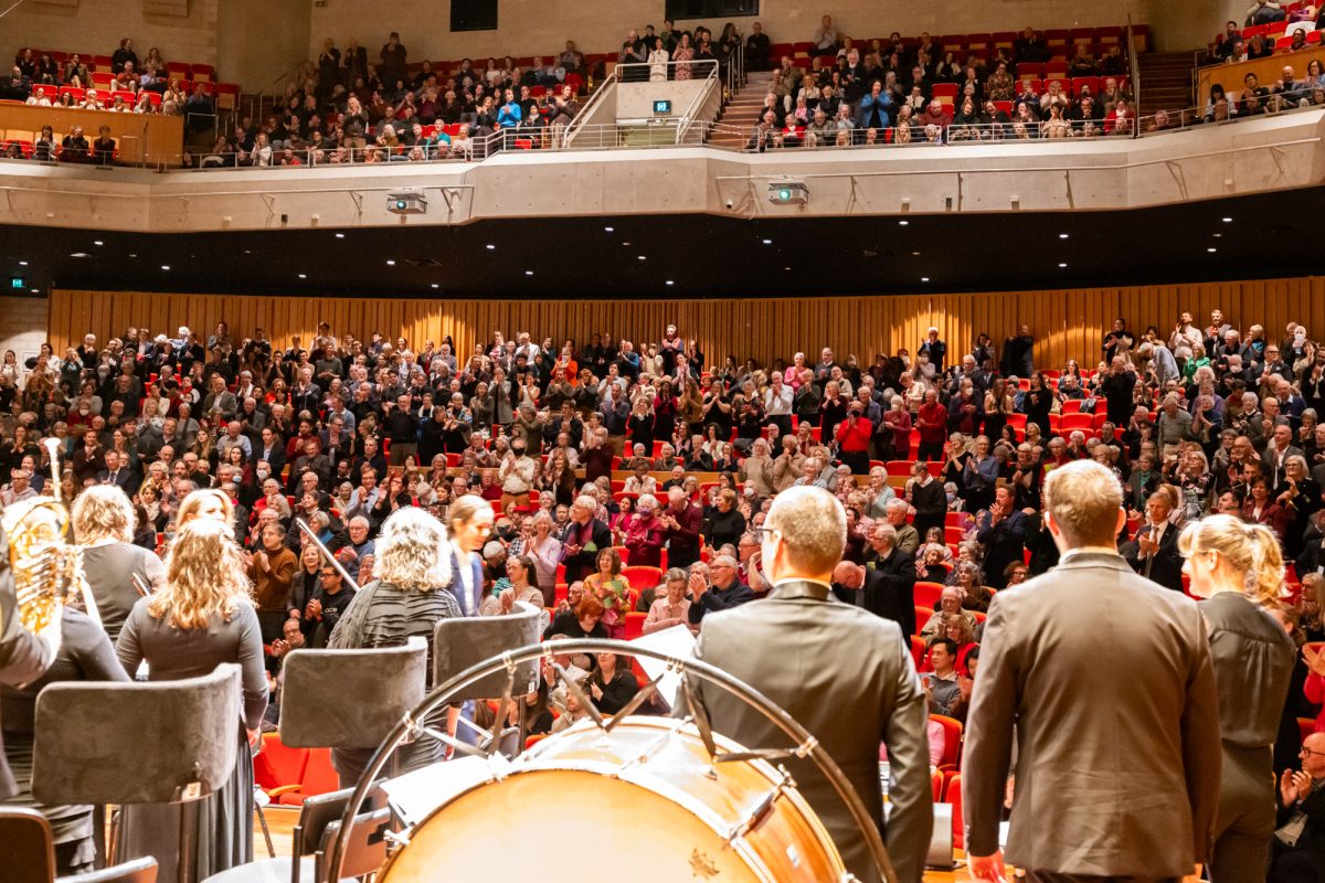 Photo of people sitting at an orchestra