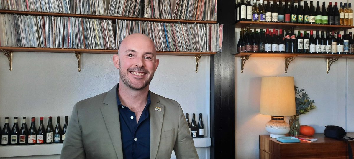 smiling man in a bar