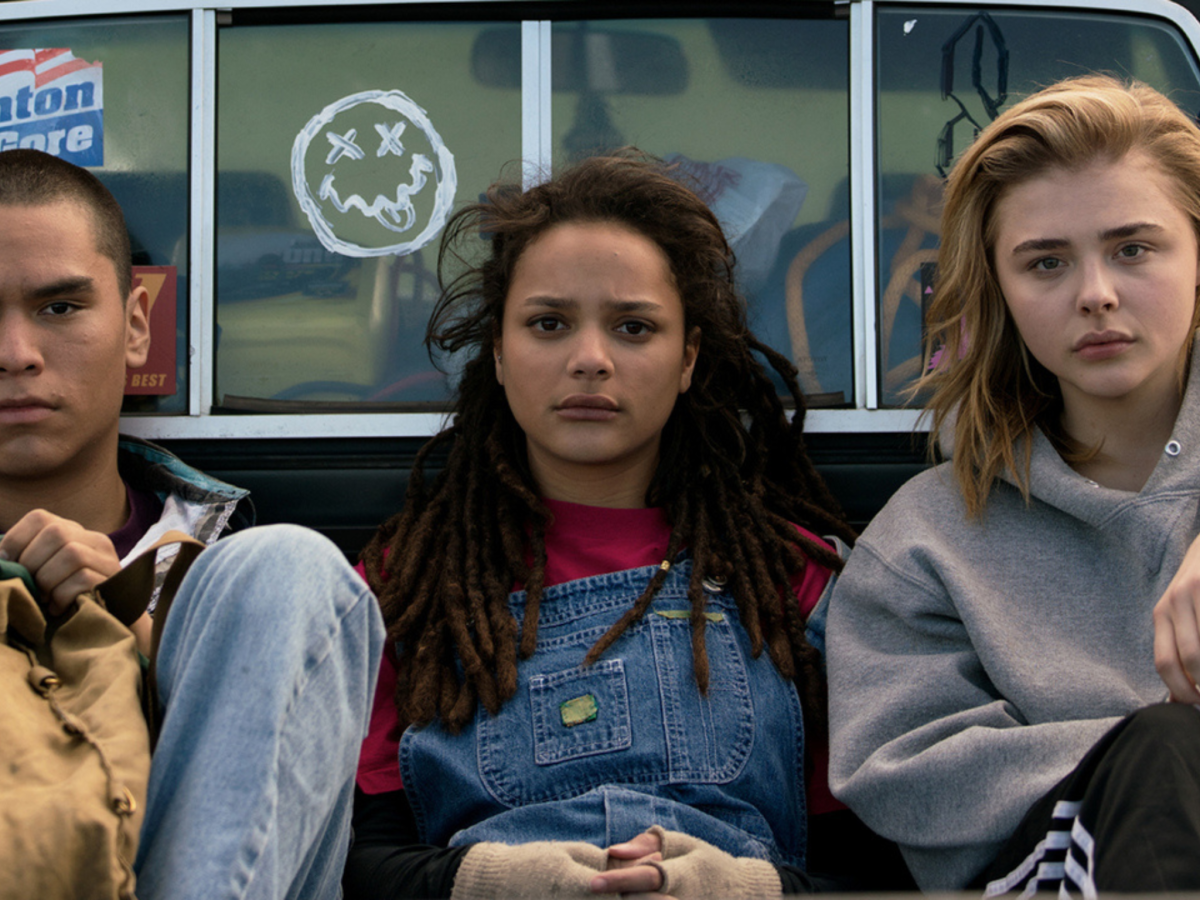 Still from The Miseducation of Cameron Post showing three teenagers sitting in the back of a truck