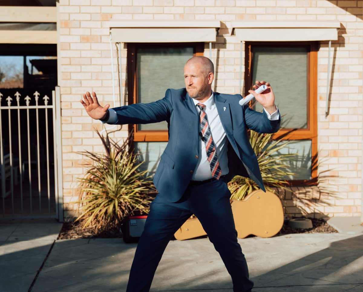 Man selling a house at auction