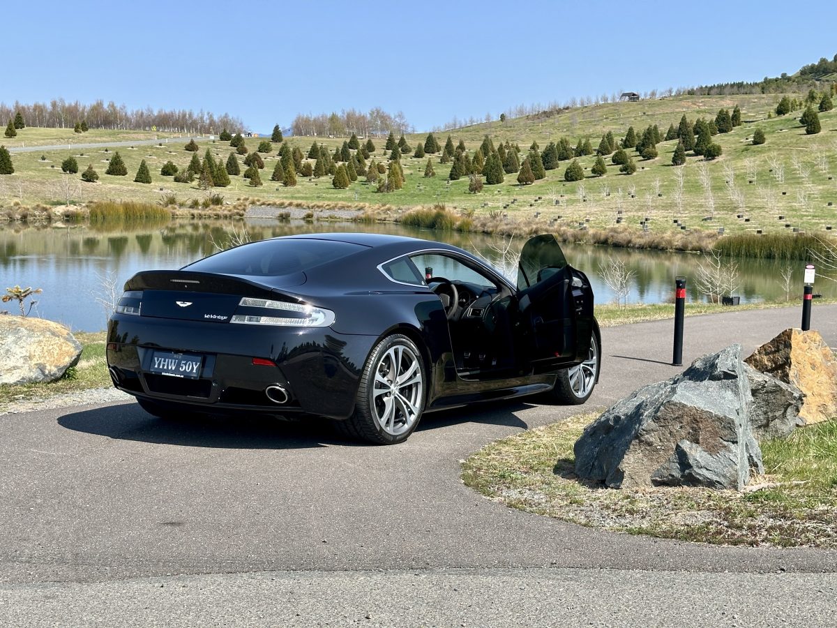 Black sports car with scenic background