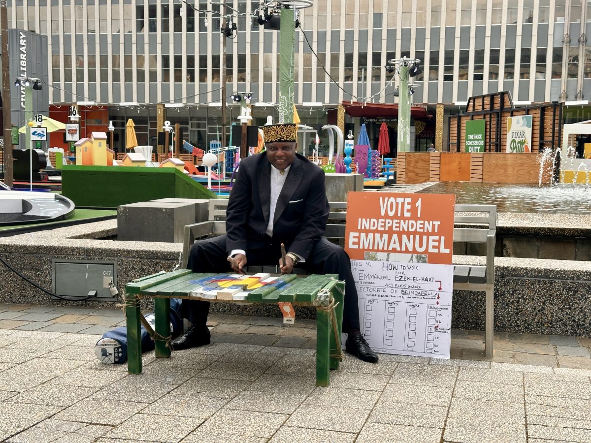 Man sitting at table outside