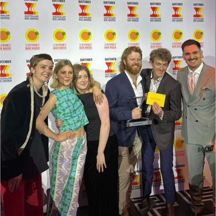 Group posing with award