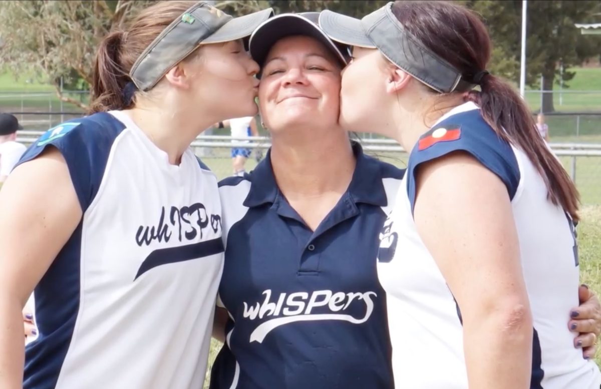 Jo Lesiputty with whISPers players. whISPers Aboriginal and Torres Strait Islander Softball Corporation involves members in softball competition with an emphasis on inclusiveness, positivity and enjoyment. Photo: ACT Health Facebook.