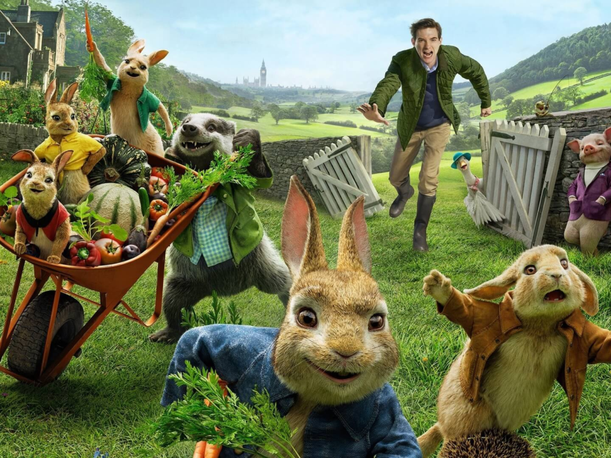 CGI animated still from Peter Rabbit showing a man chasing a number of animated rabbits