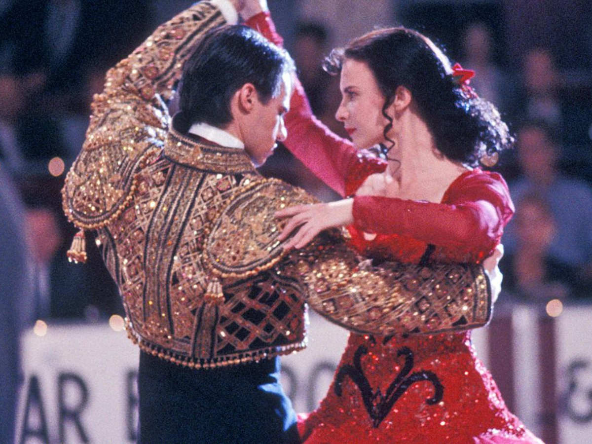 Still from Strictly Ballroom showing a pair of ballroom dancers performing