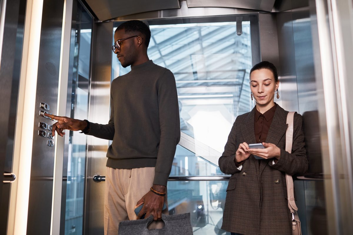 Colleagues in Office Elevator