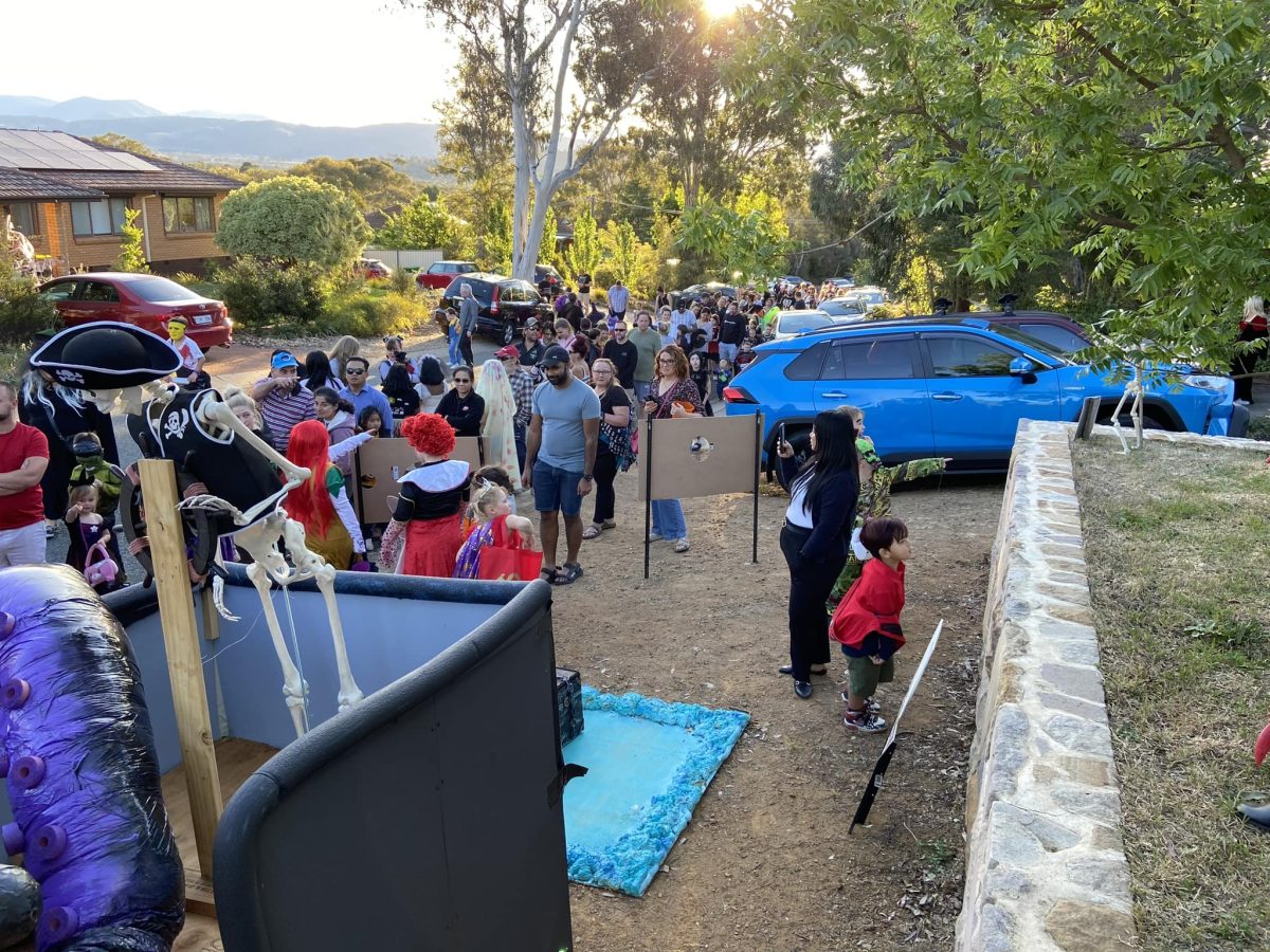 crowd waiting to see Halloween decorations