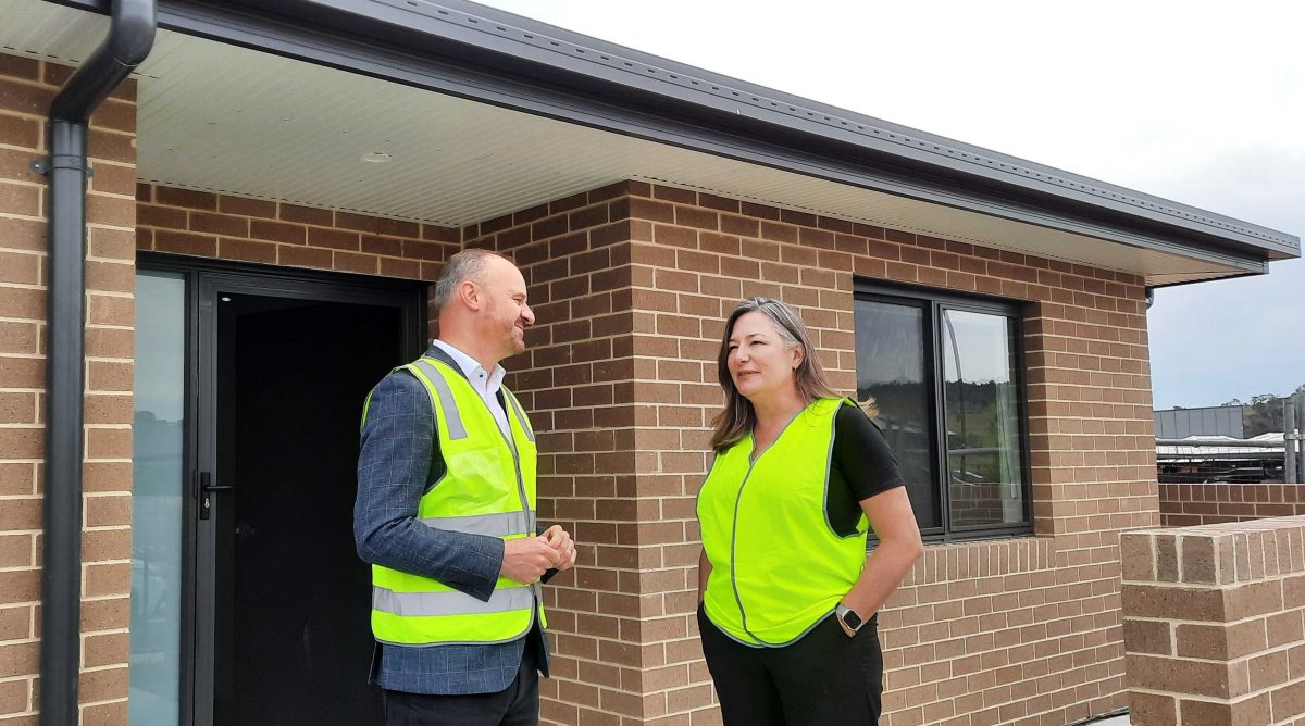 a man and a woman at a new public housing property