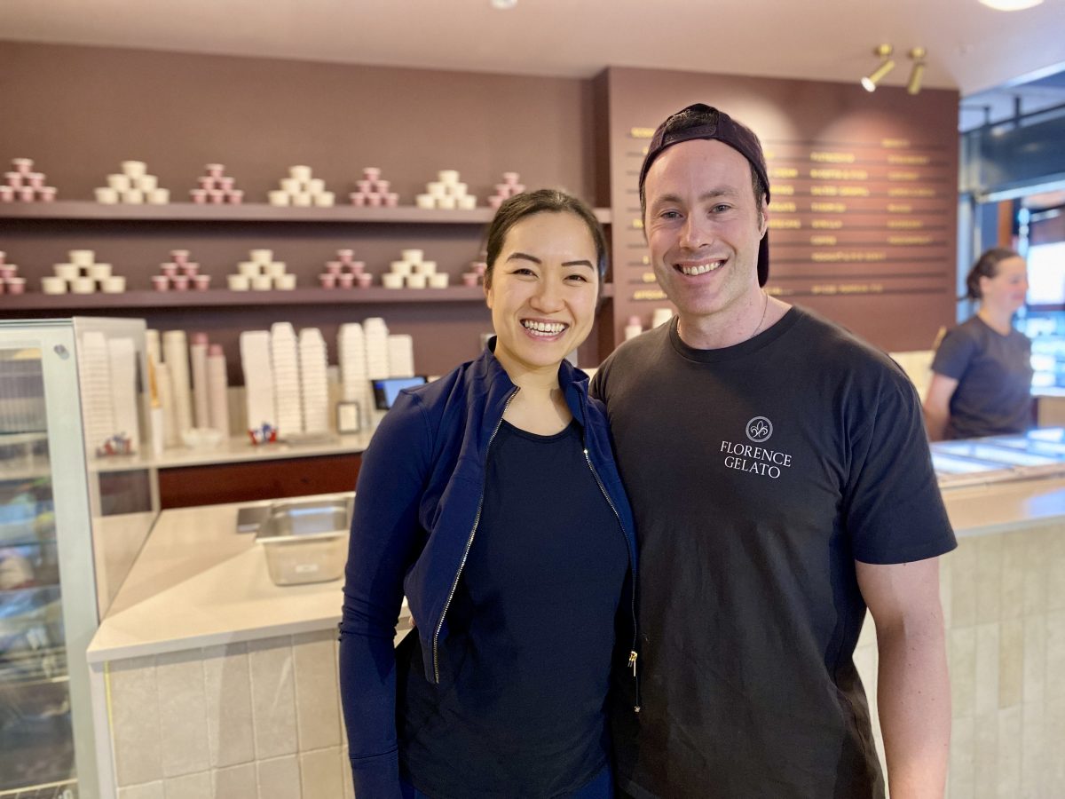 Matteo Sassi with partner Julianna Sassi in front of a gelato shop.