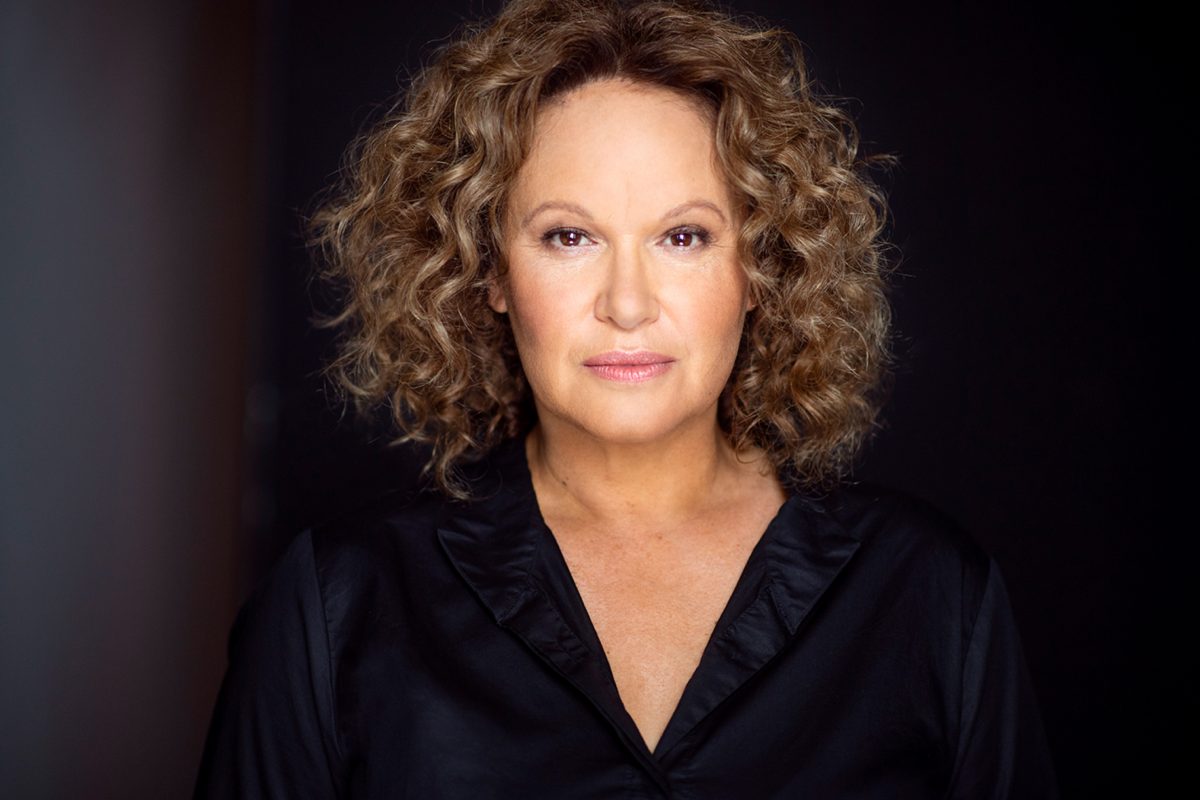 Portrait of woman with short curly hair