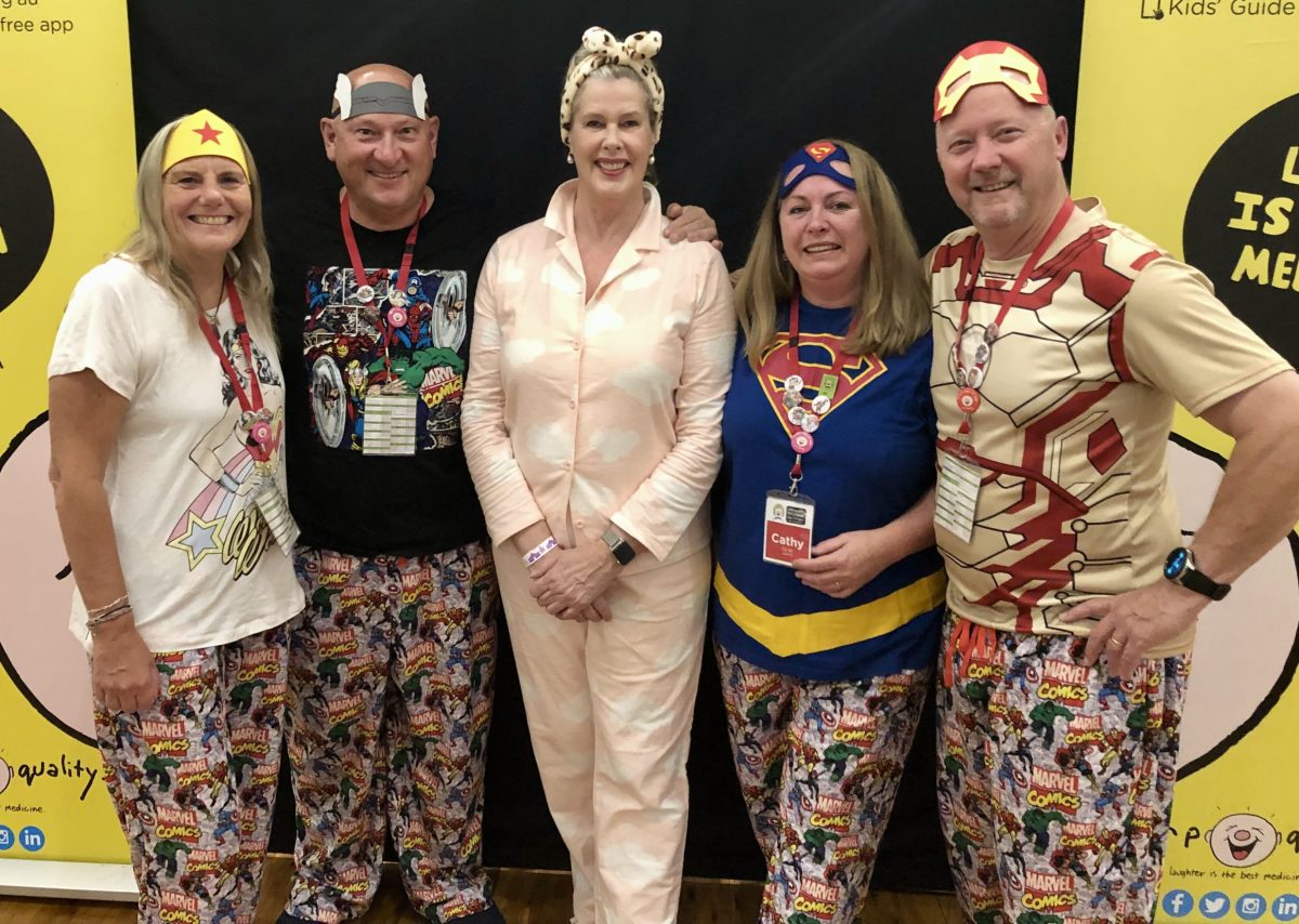 Superheroes ACT members Anna and Ivan Slavich, Deborah Thomas and Cathy and Brett Norton with Camp Quality CEO Deb Thomas in her pink pyjamas during an esCarpade stop