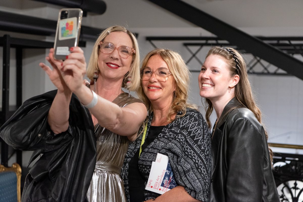 THree womwn taking a selfie