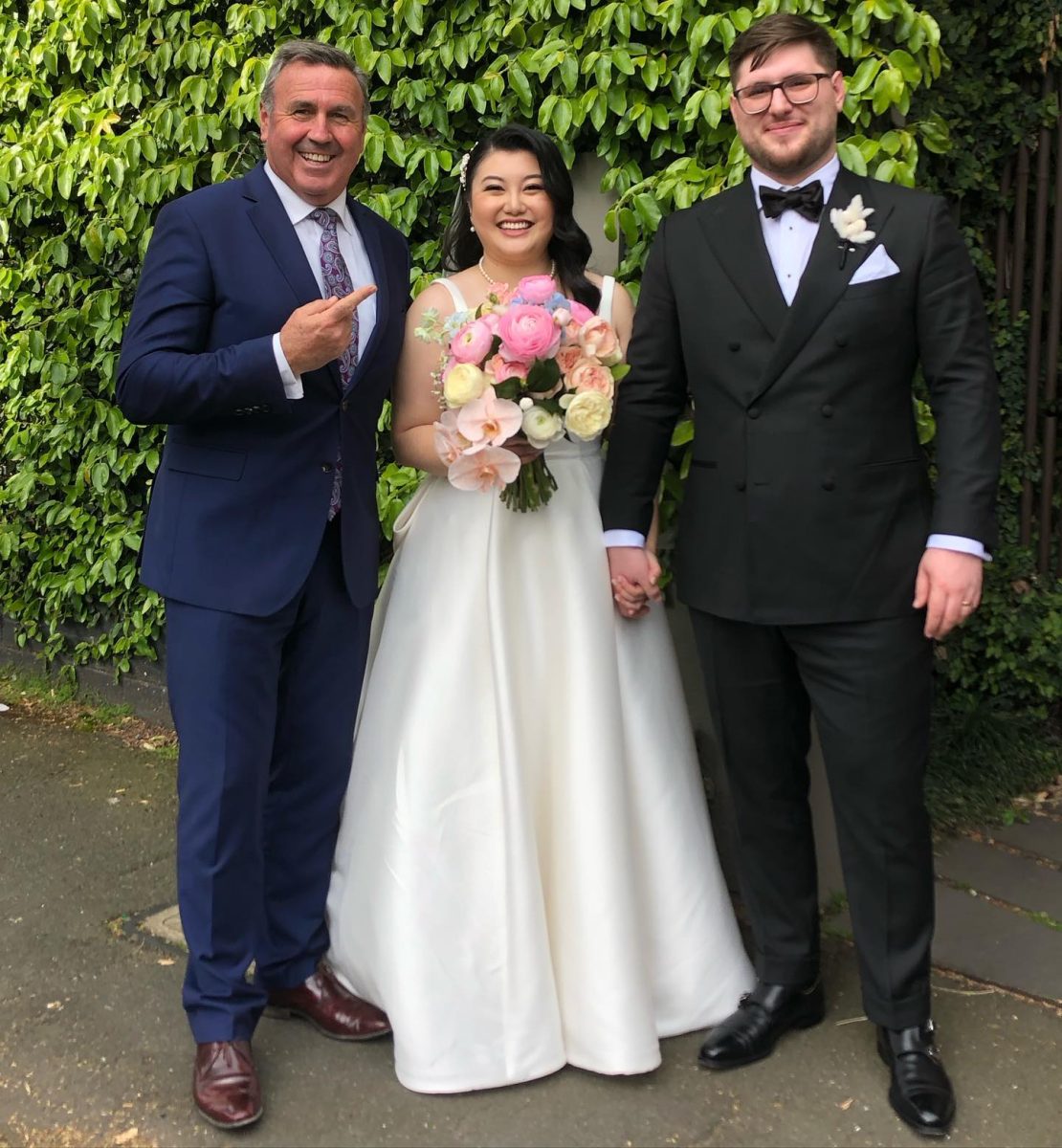 celebrant with bride and groom