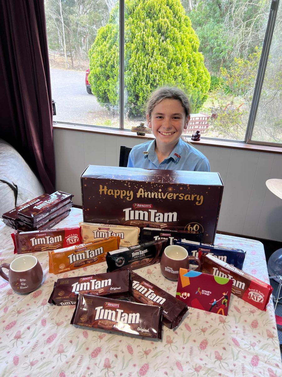 Ivan Pearce with Arnott's Tim Tam gift box