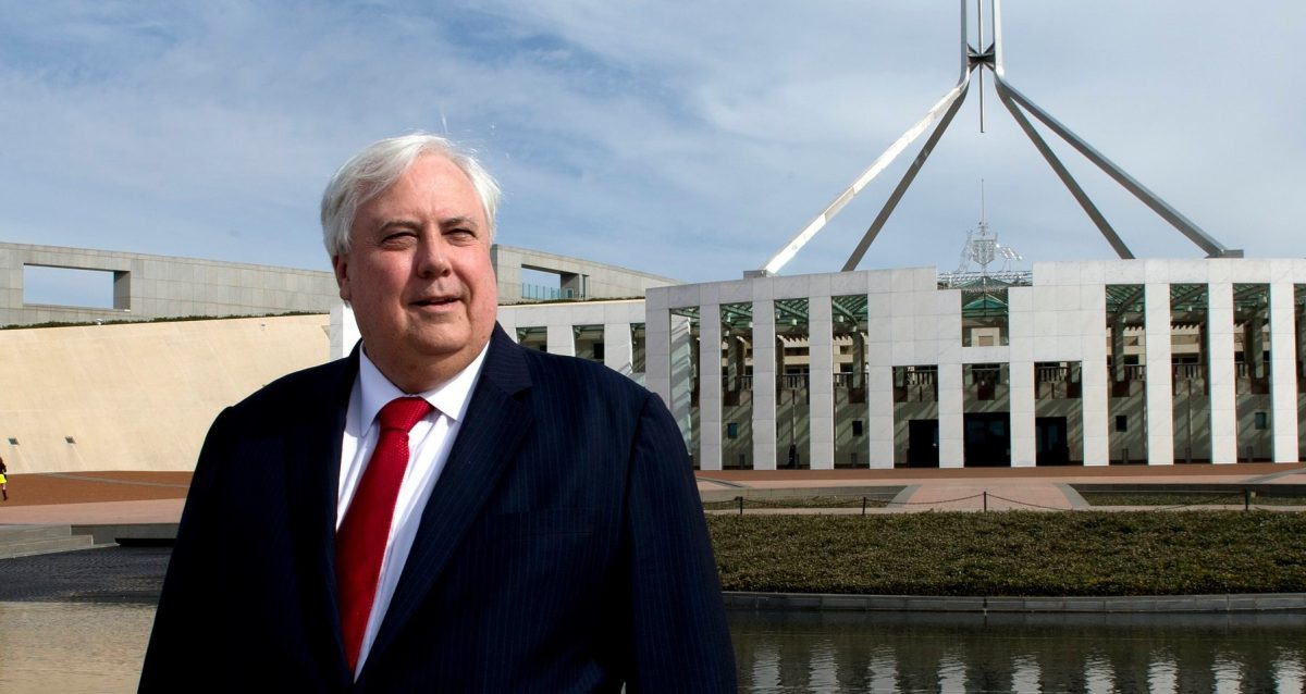 Man in front of Parliament House in Canberra