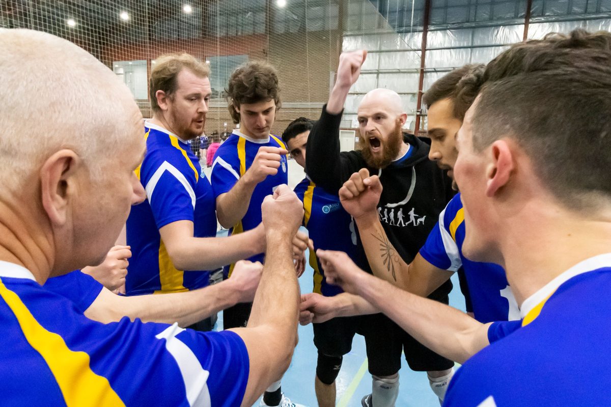 Volleyball team huddle.