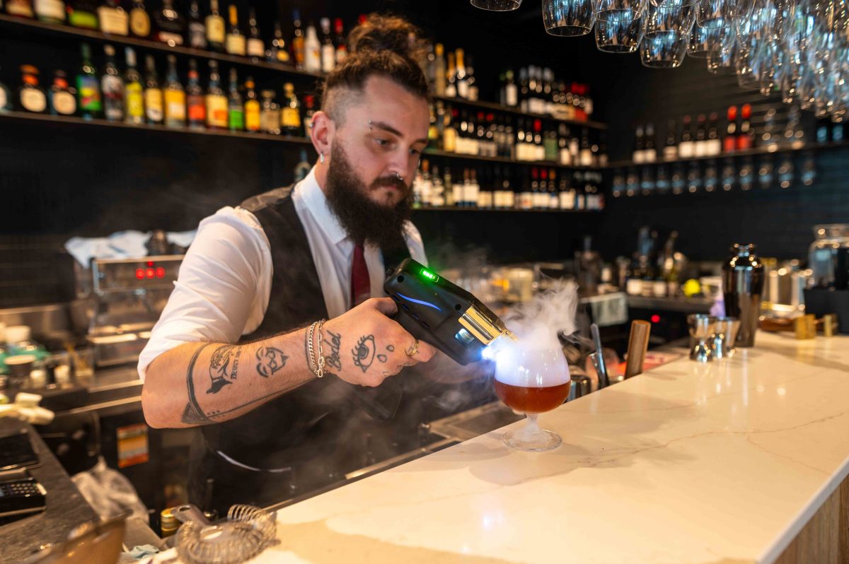 man making cocktail