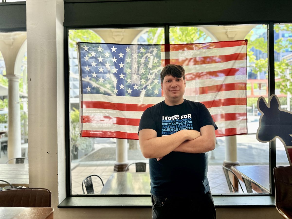 man in front of American flag