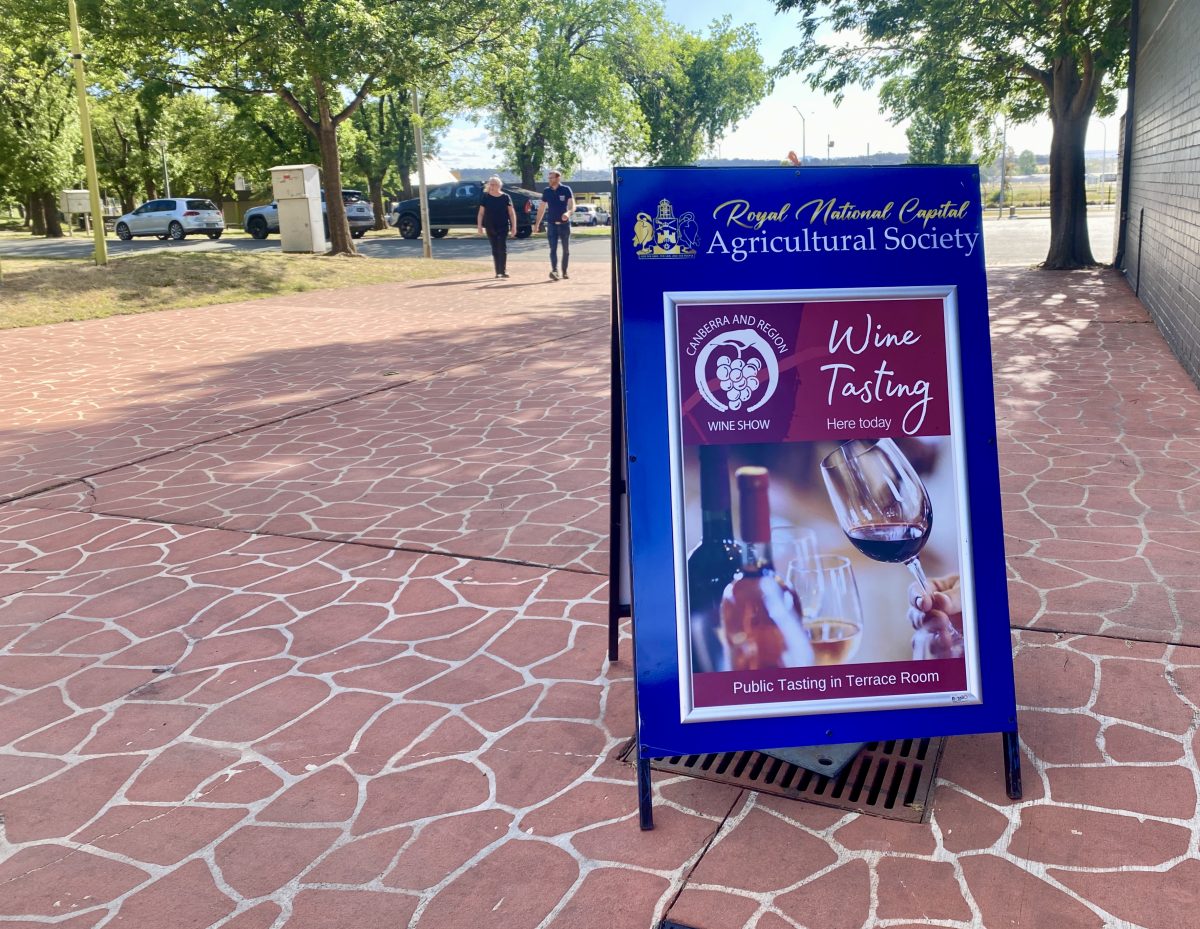 An A-frame sign for the wine tasting event.