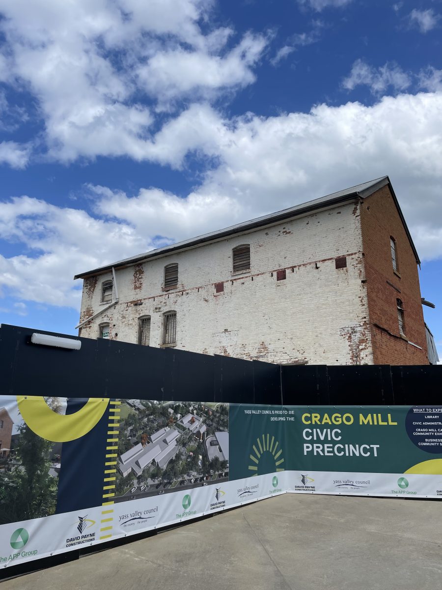 Crago Mill Precinct sign in front of old mill