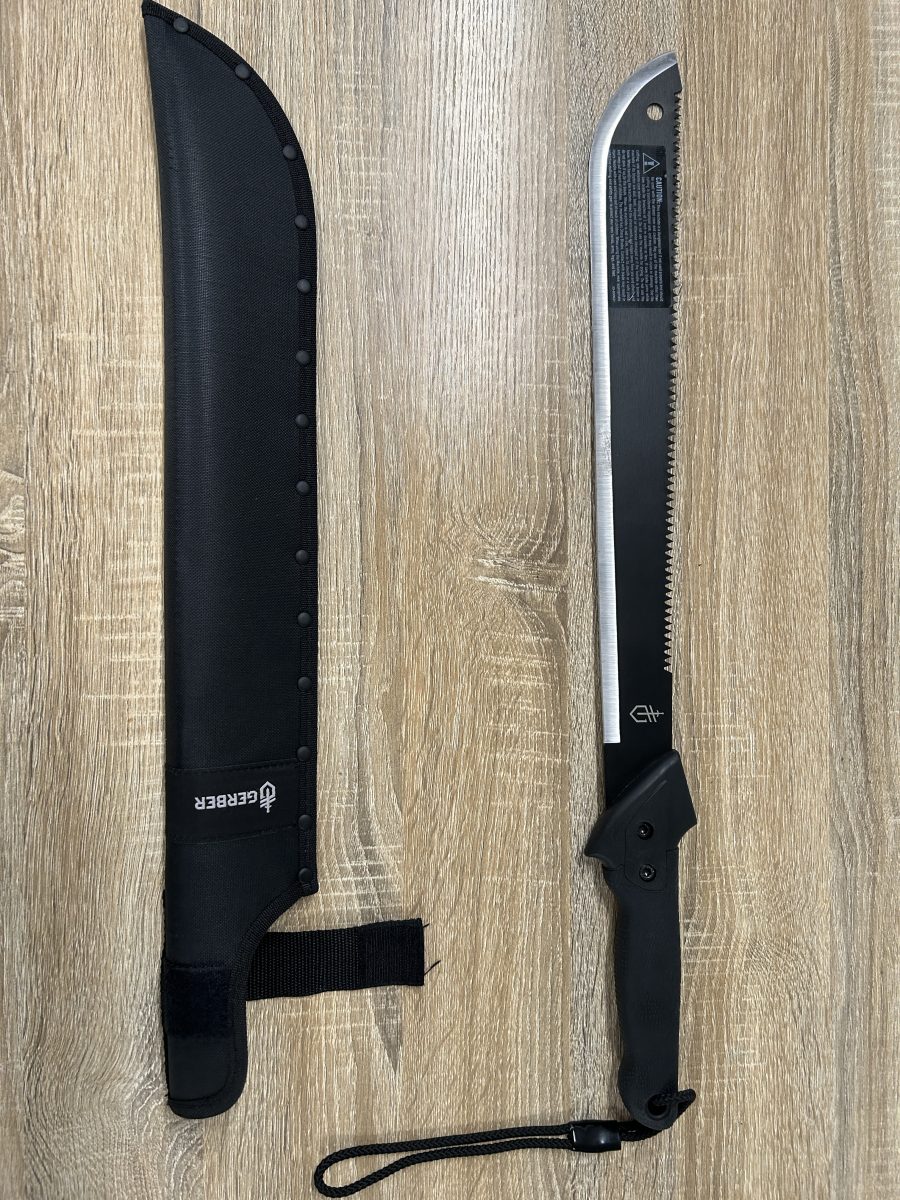 A sheath and a machete, lying next to each other