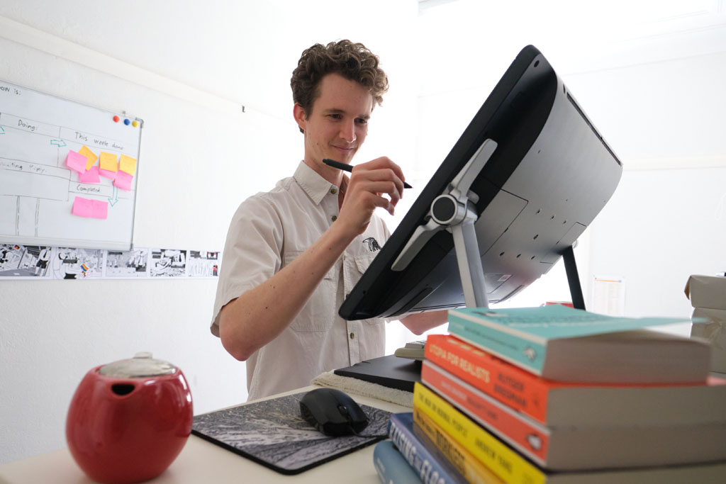 Stuart McMillen at work on his computer