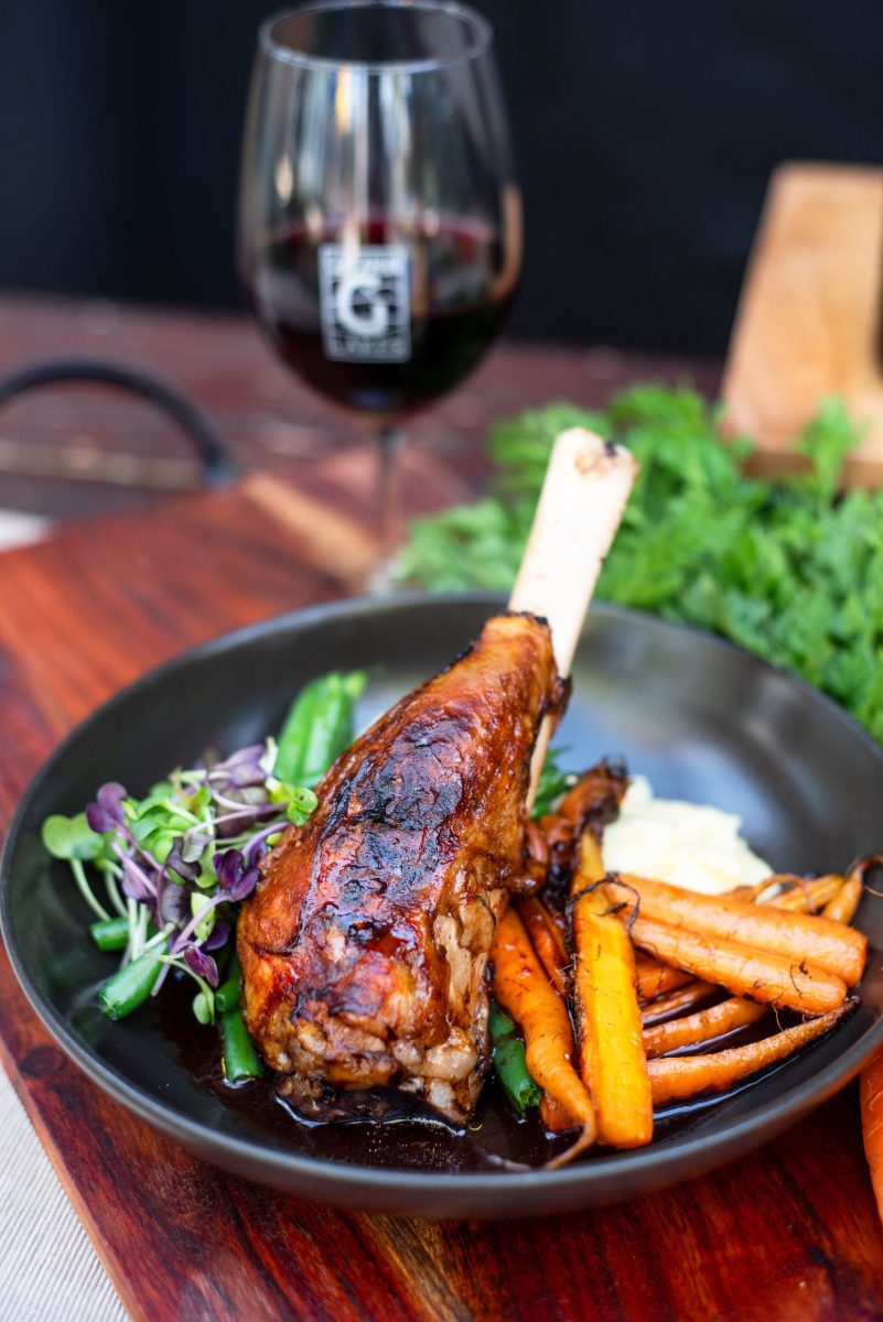 cooked lamb shank and vegetables