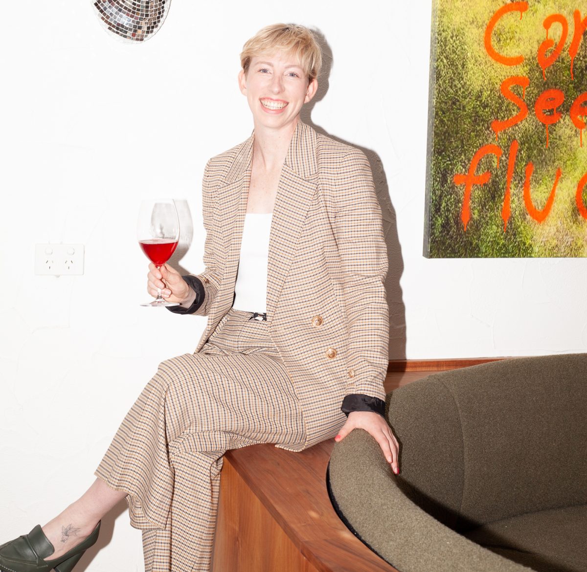 woman holding a glass of wine