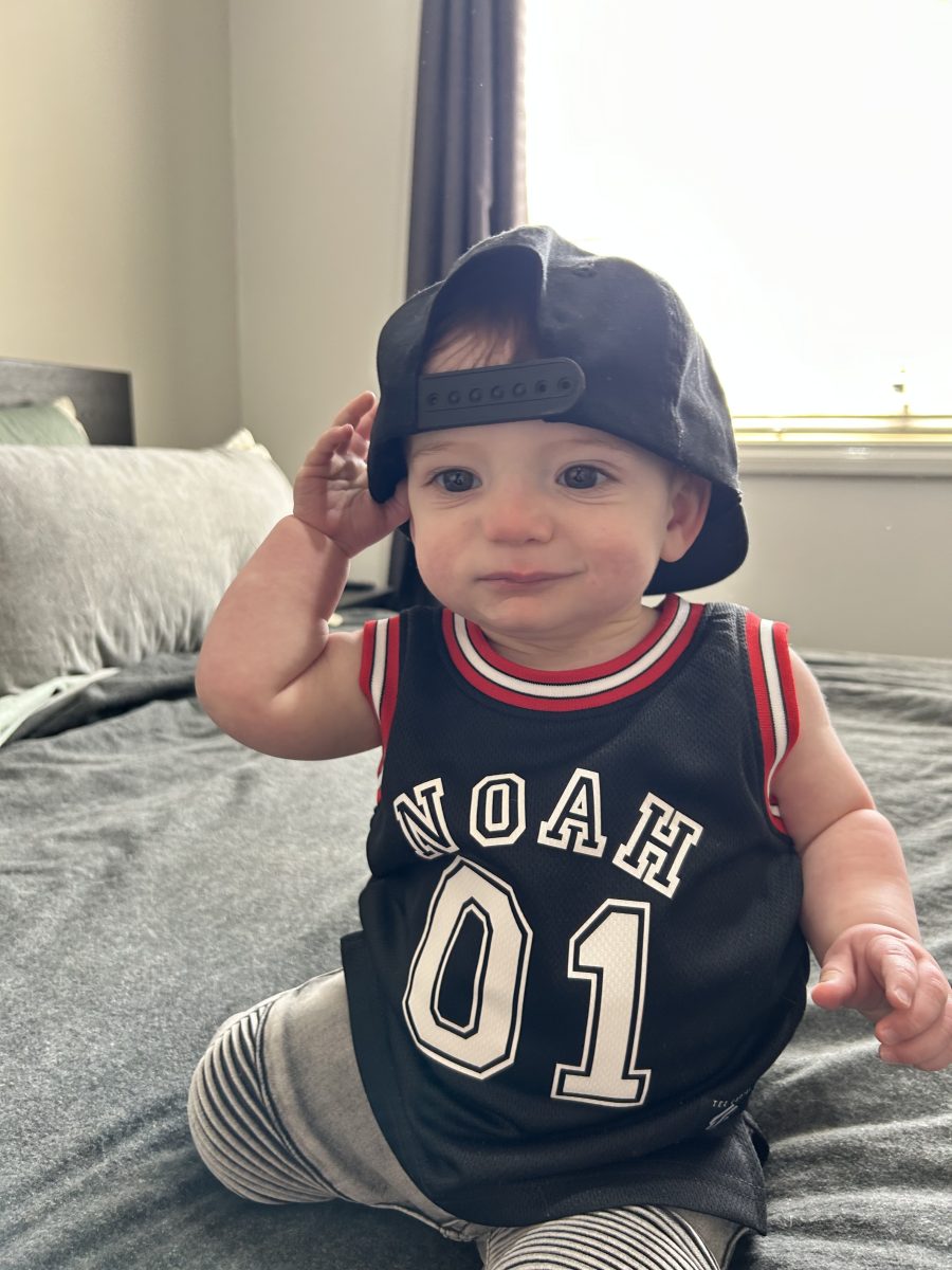 Noah Ashley Cole in Noah shirt with hat backwards