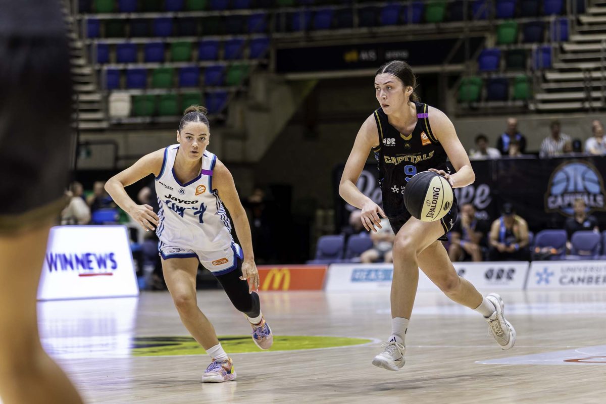 two WNBL players on court