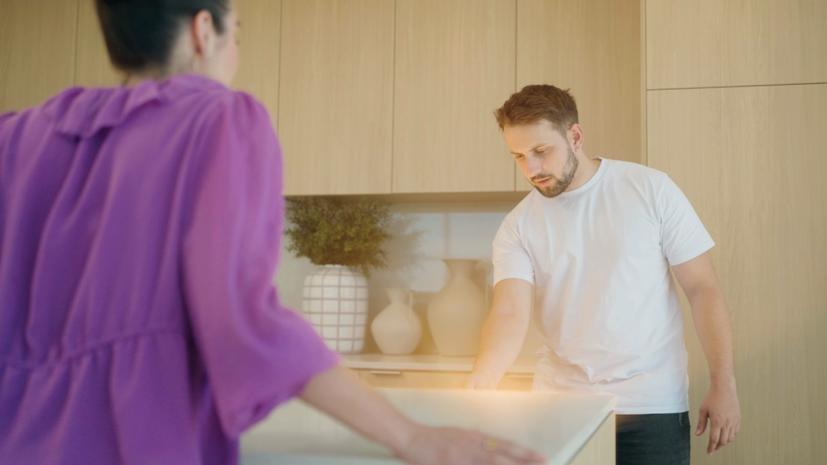 Man opens a glowing draw in a new home