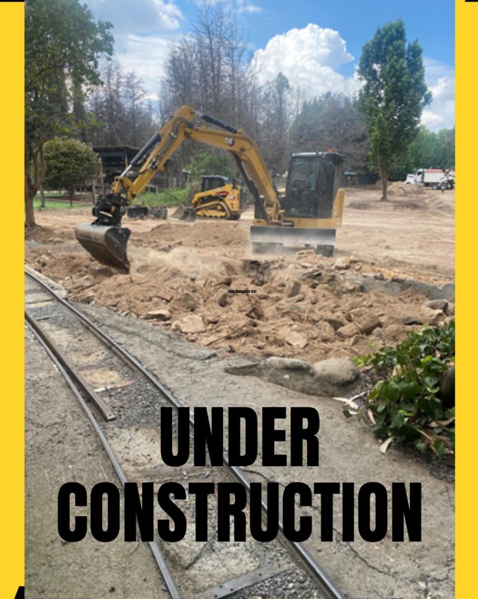 Bulldozers and an `Under Construction' statement