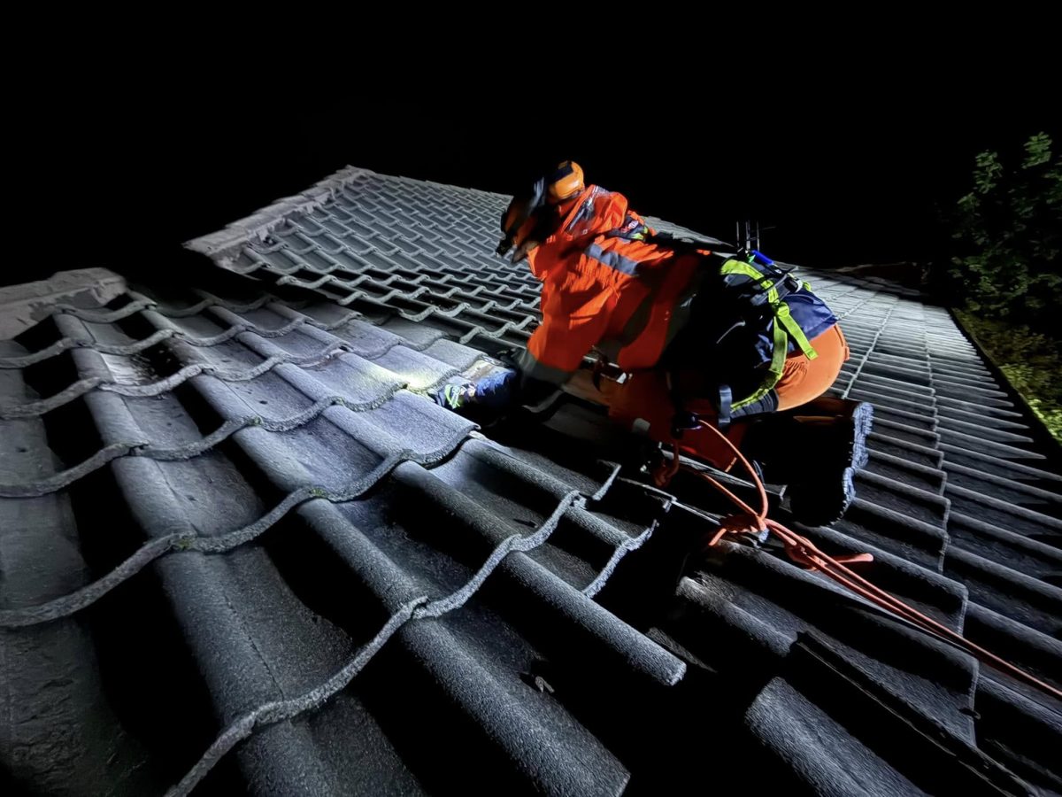 SES volunteer working on a roof