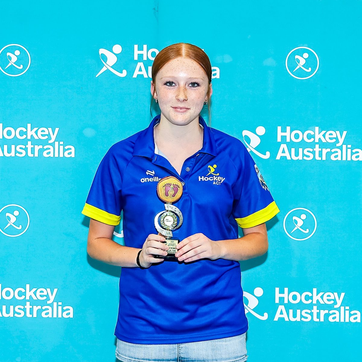 Lani Hill holding an award